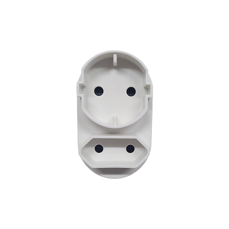 White Plastic Electrical Outlet Adapter with Two Circular Socket Holes on the Top and Two on the Bottom Against a White Background a Modular Power Plug Component