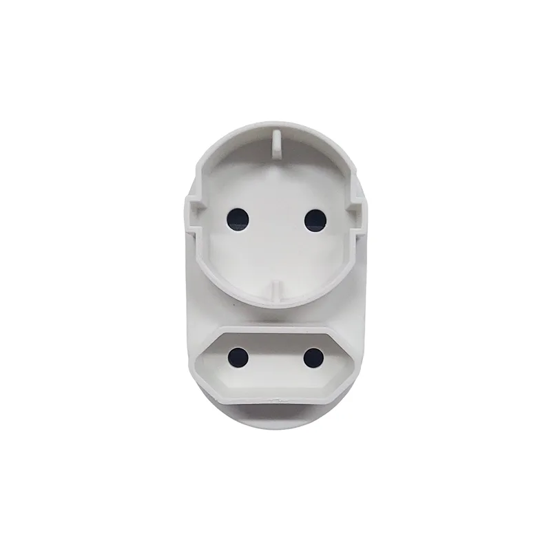 White plastic electrical outlet adapter with two circular socket holes on the top and two on the bottom against a white background; a modular power plug component.