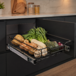 ChatGPT Image Apr 23 2026 12_42_02 PM | Securadeal Open Pull out Drawer in a Modern Kitchen Filled with Fresh Vegetables Potatoes Onions Garlic Leafy Greens a Squash and a White Root Vegetable All on a Metal Rack