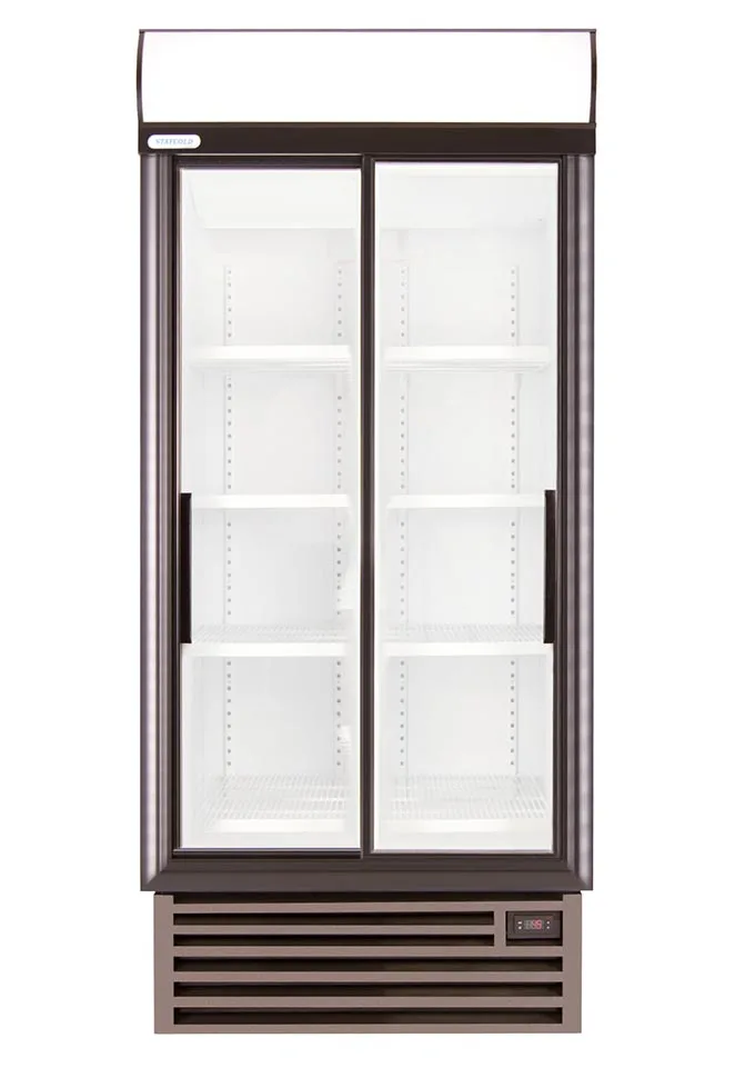 Double-door glass-front commercial refrigerator with empty shelves and bottom vented base at the bottom start of display case.