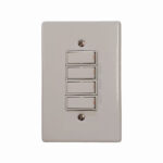 White Four gang Light Switch Plate with Four Vertical Rocker Switches on a Wall Plate