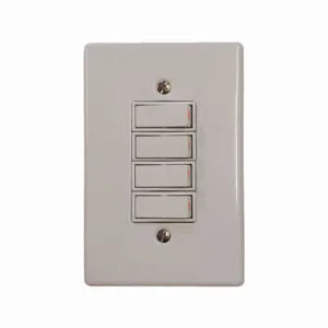 White four-gang light switch plate with four vertical rocker switches on a wall plate