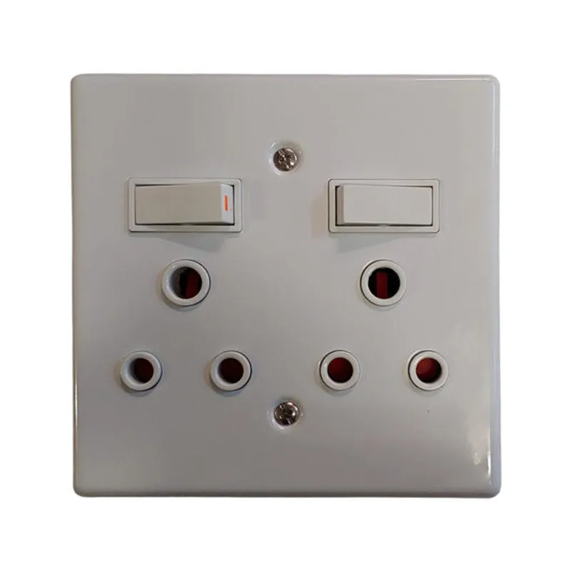 White dual-switch wall plate with several round UK-style outlets arranged in two rows beneath the switches