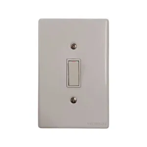 White single-gang wall light switch on a glossy rectangular plate
