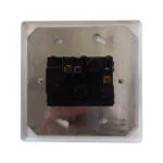Back View of a White Wall Switch with a Metal Mounting Plate and a Black Internal Switch Module Showing Terminal Contacts and Mounting Holes
