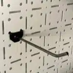 3 | Securadeal Curved Metal Pegboard Hook Protruding from a Perforated Wall Panel with a Black Mounting Base tool hanging Hook