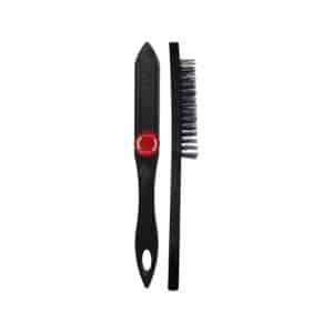 Two black cleaning tools: a plastic scraper with a red circular grip and a slim bristle brush next to it.