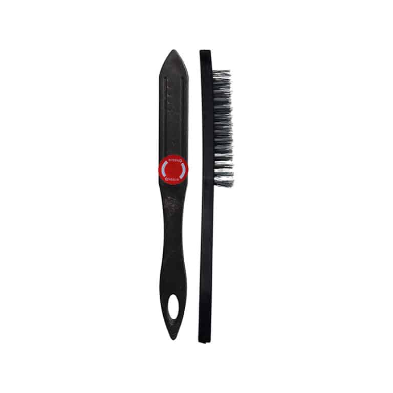 Two black cleaning tools: a plastic scraper with a red circular grip and a slim bristle brush next to it.